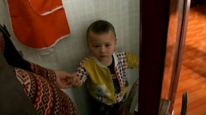 Little boy's fingers stuck in door