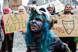 Demonstrators protest outside the Scottish Parliament over proposed government cuts