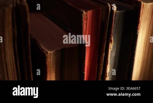 Stack of old antique books in a ray of light. Close-up view, slider macro 4K video Stock Video Footage - Alamy
