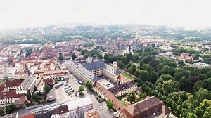 The city of Fulda in Germany. The camera rises into the sky above Fulda. It then flies slowly over the historical city of Fulda in Hessen.