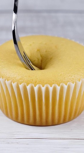 Discover the joy of baking Vegan Vanilla Cupcakes that are dairy-free, egg-free, and butter-free – perfect for everyone to enjoy! Ingredients: 1 1/2 cups (210g) all-purpose flour • 3/4 cup (150g) granulated sugar • 1 tablespoon (12g) baking powder • 1/8 teaspoon (pinch) salt • 1/3 cup (75ml) vegetable oil • 1 cup (250ml) warm water 90-110°F (32-43°C) • 1 tablespoon (15ml) vanilla extract Steps: 1) Combine all-purpose flour, granulated sugar, baking powder, and salt in a mixing bowl. 2) In a sepa