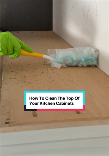 Your kitchen cabinet tops collect more grease and dust than almost anywhere else in the kitchen. If you’ve never cleaned them, this is how to do it the right way. Start by giving everything a dry dust. Next, spray a degreasing cleaner directly onto the surface and let it sit for a few minutes to break down built up grime. For this, I like to use 1 teaspoon of dish soap mixed with water in a spray bottle. Use a non scratch sponge to loosen everything up, then wipe it clean with a damp microfiber 