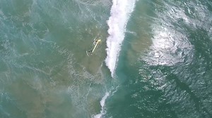 Watch a drone rescue two swimmers