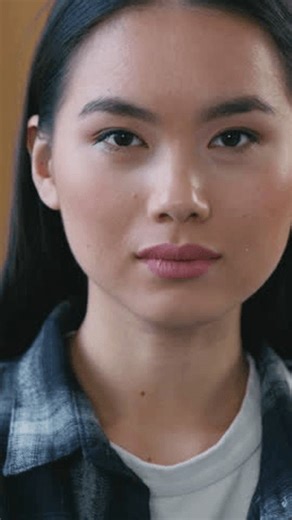 clip-4007318461-close-young-asian-japanese-woman-showing-thumb