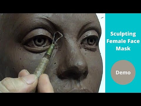 Sculpting female face mask design in a water based clay.