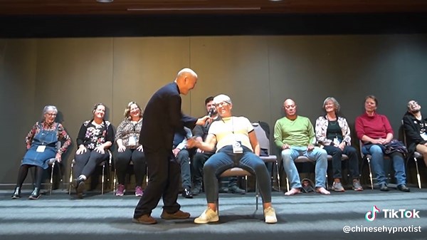 Hypnotized People Enjoying Unique Handshake Experiences