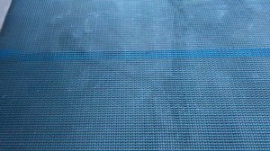 clip-1099355525-4k-video-footage-laying-reinforcing-nylon-mesh