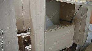 how to install built-in stand for tableware in the kitchen cupboard Stock Video