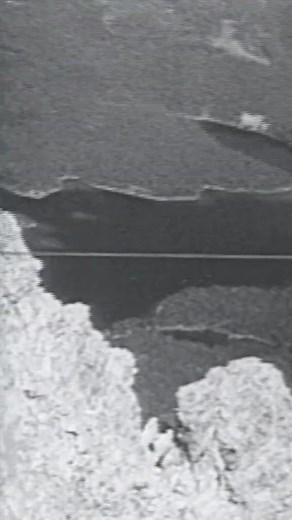 Don't look down! 📽 A daredevil performs a tightrope act over the Alps in the 1920s. | Exploring History Reels
