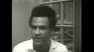 USA, 1960s. Black Panther Party co-founder Huey P. Newton speaking to news media, answering question about his good spirits. 4k Overscan film