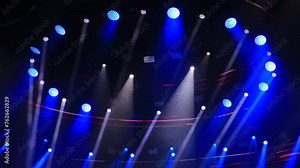 Spotlights in the concert hall. Stage light with colored spotlights and smoke.