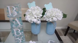 1.7K views · 18 reactions | " If you’re planning an upcoming baby shower and need some ideas, I got you covered! In this video, I share with you how to make these DIY mason jars and confetti baby blocks. I created these distressed-painted mason jars that paired perfectly with the silk hydrangea flower..." credit: Rachel Estrada @https://bit.ly/38B6TBK | Gender Reveal Parties R Us | Facebook
