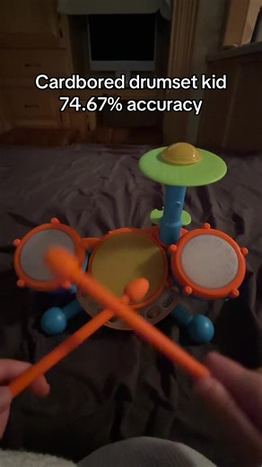 Creative Kid Drumming on Cardboard