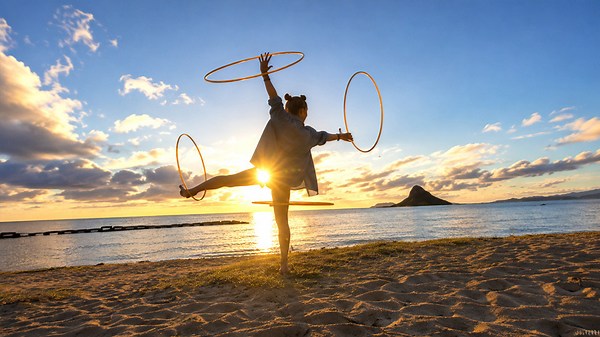 Hula hoop mastery creates stunning visual flow