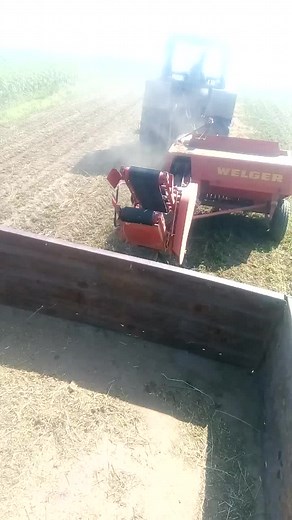 WELGER Agricultural Machine Operations in Sunny Fields