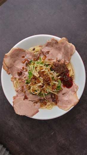 Thin noodles in silky-rich tonkotsu. Tender chashu layered with Negi sauce, aromatic leeks, crisp fried onions, and that umami-packed garlic–ginger soy. Finished with a gentle fire sauce heat — fresh, fragrant, and undeniably bold. 𝐓𝐡𝐞 𝐍𝐞𝐠𝐢 𝐊𝐢𝐧𝐠 arrives this January 1, 2026 at all Ramen Nagi shops, @nagiizakayaph, and @nagisushiph. A bowl that takes the humble negi and turns it into pure flavor masterpiece. 🍜 #RamenNagiPH #FavoriteRamen | Ramen Nagi PH