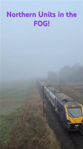 Northern Class 333 and double headed 6 car Class 331 pass in the fog near Guiseley