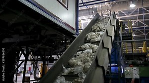 moving conveyor transporter on Modern waste recycling processing plant. Separate and sorting garbage collection. Recycling and storage of waste for further disposal.