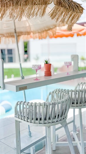 Alex Hutchinson on Instagram: "Our good friends from the Gold Coast @thebenchbaraus have created the perfect bar table light enough to hang from your pool fencing! Loving this little upgrade to our deck space! Entertaining just got a whole lot easier! #bartable #poolbar #airliebeach #bararea #coastalhome"