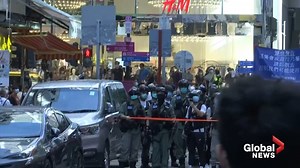 Pro-democracy protesters clash with police as China reviews controversial security bill