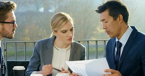 Co-Workers Solving Business Problems Brainstorming For Options Stock Video