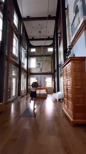 The Swing House, created by Cincinnati-based artist Mark de Jong and launched in 2017, is an experimental space centered around a suspended swing. Its movement mimics a pendulum, symbolizing the passage of time, while historical layers remain visible on the walls beneath an hourglass-shaped ceiling painting. Over three years, de Jong transformed the house, incorporating salvaged materials into artworks in the basement. The furniture, art, and exhibition elements evoke a sense of weightlessness, 
