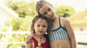 Two Little Girls Swimsuits Eating Ice Stock Footage Video (100% Royalty-free) 3885207027 | Shutterstock