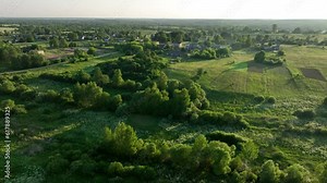 Rural landscape. Country houses in countryside. Village Home in Country. Wooden house in Russian villag. Agricultural field with Suburban house. Rural building in countryside. Roofs of village home.