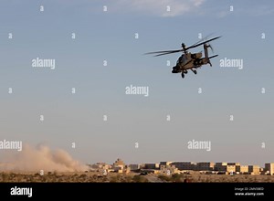 A U.S. Army Boeing AH-64E Apache, supporting Marine Aviation Weapons and Tactics Squadron One (MAWTS-1), conducts close air support during Weapons and Tactics Instructor (WTI) course 1-23, at Yodaville, near Yuma, Arizona, Sept. 28, 2022. WTI is a seven-week training event hosted by MAWTS-1, providing standardized advanced tactical training and certification of unit instructor qualifications to support Marine aviation training and readiness, and assists in developing and employing aviation weapo