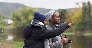 Nature, hiking and happy couple with binoculars, coffee and sightseeing adventure on lake holiday. Love, quality time and trekking in countryside, woods or forest, man and woman on camping together.