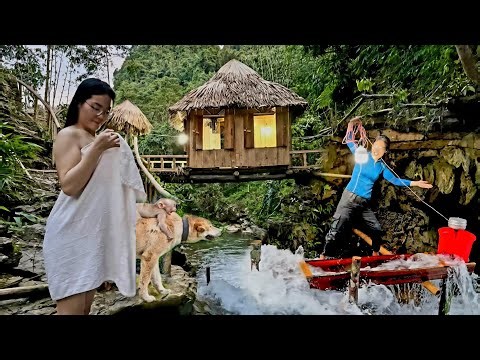 The girl built a mini generator on a small stream with a powerful engine