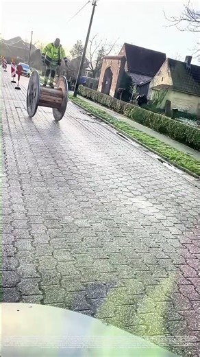 Rolling with Gravity: How Workers Use Cable Reels as Mobile Platforms