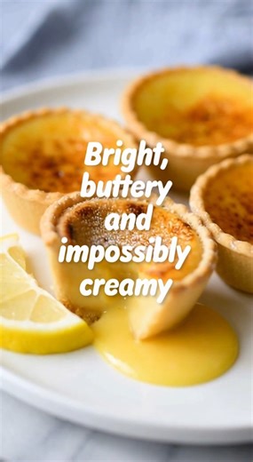 🍋 Baby Lemon Impossible Pies | Little golden bites that magically make their own crust ✨ These **baby lemon impossible pies** are pure vintage dessert magic. They bake up soft and custardy in the center, with a lightly crisp, buttery edge — all from one simple batter. No crust to roll, no fuss, just that bright lemon flavor tucked into the sweetest little individual pies. They remind me of old church cookbooks and bakery cases filled with “just one more” treats. Warm or chilled, each bite is cr