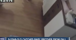 Boy catches baby from changing table fall