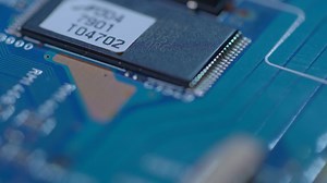 Tracking Over a Processor on a Blue Circuit Board | Free Stock Video Footage