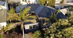 A Tesla Solar Roof system is deployed for under $30,000