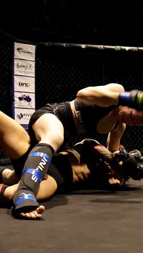 @theultimatefightexperience on Instagram: "There’s no such thing as a boring women’s MMA fight. They walked into the cage with pressure, expectation, and something to prove, and under the bright lights, they showed exactly what they’re made of. The crowd was treated to a high-paced grappling showcase, with rising talent @navyboxsara of @growstrongmma securing the win via a slick armbar finish. Your turn next. Lock in your 2026 Ultimate Fight Experience via the link in my bio. 🔥"