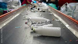 close up Used plastic bottles go to a waste sorting line at special station for further processing or disposal