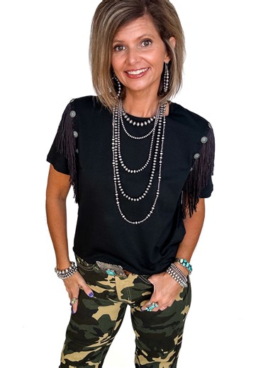 ✨ Fringe concho buttons = everything you love about Western style in one top. The Get Fringy With It tee takes a classic black body and kicks it up a notch with fringe shoulders and concho details. It’s stretchy, comfy, and easy to style—perfect for pairing with our L&B x RR Exclusive Jeans for that edgy look. 👉 Available XS–3X 👉 Fringe concho button shoulder detail 👉 Comfy fit with a Western twist 🚀 Ships fast from Mineral Wells, Texas 💎 P.S. Yep, the jewelry is Rolling Ranch too! 📲 And d