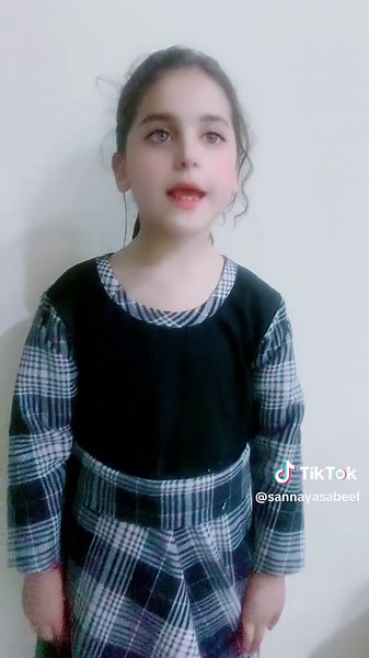 Child's Fashion: Black Top and Plaid Skirt Style
