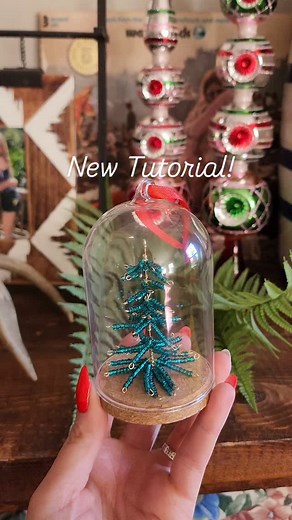 This adorable whimsy beaded tree ornament will look so cute on your tree! The glass cloche adds the perfect touch! Comment TREE to have this full tutorial sent right to your inbox! Tutorial is for @michaelsstores using amazing beads from @johnbeadcorp | Lauren Quigley Creations