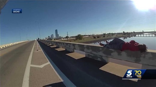 Body camera video shows OKC officer, runner saving man from falling off bridge