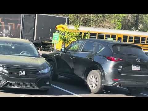 School Buses Puling In High School 