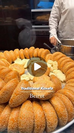 BEAUTIFUL CUISINES on Instagram: "Take a cheesy journey with @withmoe to the heart of Lebanon and get to know their iconic Kunafa! 🇱🇧 This crispy and buttery treat is loaded with a heavenly cheese layer and served in a sesame bread “Ka’ak”, making it the perfect street-style breakfast. 🧀👌 What other Lebanese dishes have you tried and loved? 🤩 📽 @withmoe 📍 Beirut, Lebanon 🎶 Fairuz - Oudak Rannan"