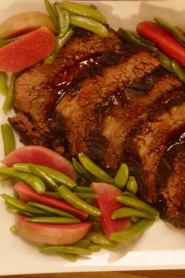 Buttered watermelon radishes with snap peas and rich brisket jus