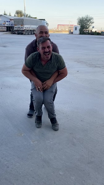 Outdoor Lifting Challenge Between Two Friends