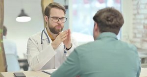 Male Doctor Talking with Patient, Treatment