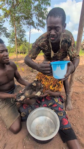 Monkey meat sizzling over the fire — wild cooking at its finest.