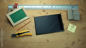 Male hands putting off sticky note with question sign using graphic tablet