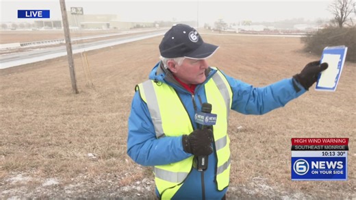 Don Dare reports on weather conditions as snow falls in Crossville